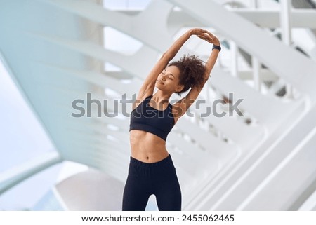 Image, Stock Photo Woman athlete standing stretching on yoga mat after training