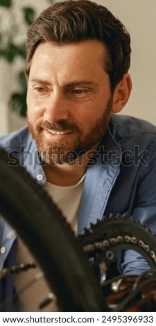 Similar – Image, Stock Photo Technician oiling bike chain in workshop