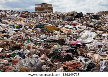 Truck managing garbage in a landfill site