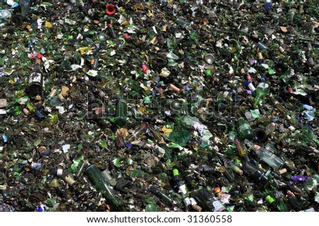 RICHMOND, VA - CIRCA 2009: A pile of crushed green glass lie in a heap at an undisclosed recycling facility circa 2009 in Richmond. The glass will be recycled.