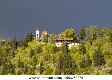 Similar – Image, Stock Photo Thunderstorm over the hill . Only a small bright glow over the blue black rain clouds, the rainforest.  As if the world wanted to end.