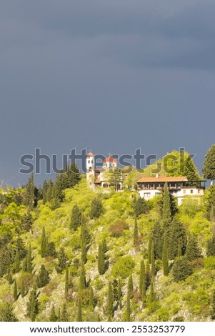 Similar – Image, Stock Photo Thunderstorm over the hill . Only a small bright glow over the blue black rain clouds, the rainforest.  As if the world wanted to end.