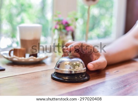 call bell at the front desk in coffee cottage.