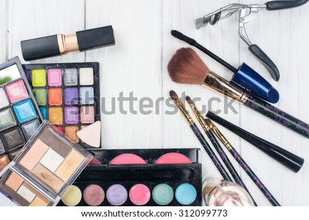 close up shadow kit with brushes for make-up.beauty background.