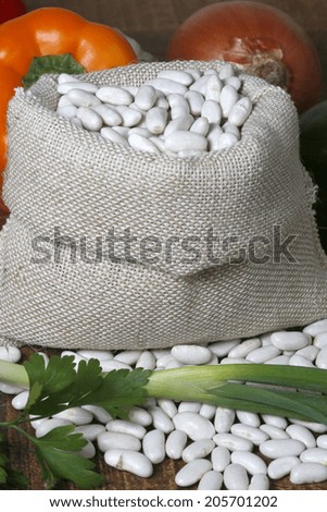 white beans with raw canvas bags.