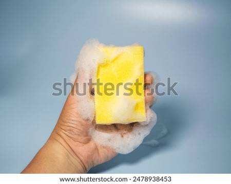 Similar – Image, Stock Photo Hand holds a yellow arrow with the word luck on it against a neutral turquoise background. Way to happiness.