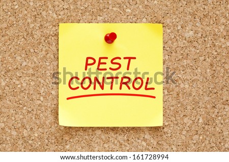 Pest Control on yellow sticky note pinned with red push pin on cork board.