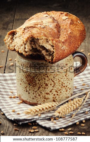 Rural breakfast with milk and bread in vintage setting