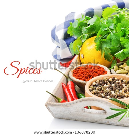 Colorful spices and herbs isolated over white