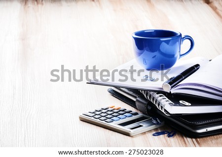 Business concept with agenda and coffee cup. Copy space