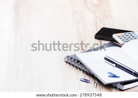 Business concept with agenda, mobile phone and calculator. Copy space