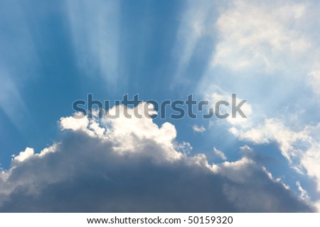 Sun rays streaming trough the clouds