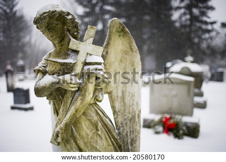 Angel sculpture in a snow storm