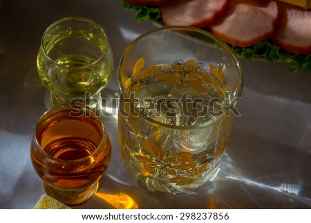 Alcoholic drinks on the table with a snack