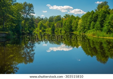 Sunny day on the quiet river in summer in Ukraine