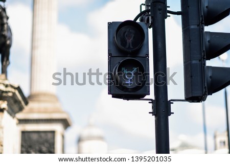 Similar – Image, Stock Photo LGBT pedestrian traffic light signals symbolizing equality