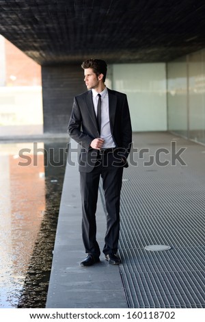 Portrait of an attractive young businessman in urban background