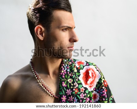 Portrait of attractive man, model of fashion, wearing spanish clothes