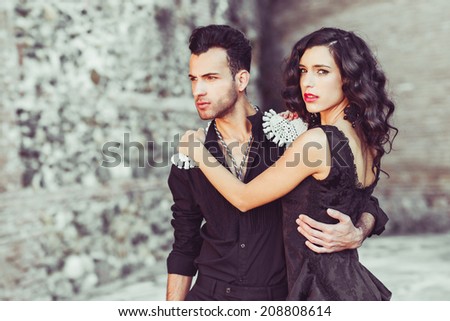 Portrait of beautiful couple, models of fashion, wearing spanish clothes
