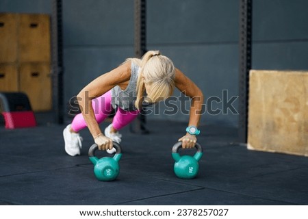 Similar – Image, Stock Photo Unrecognizable sportswoman exercising with elastic band at home