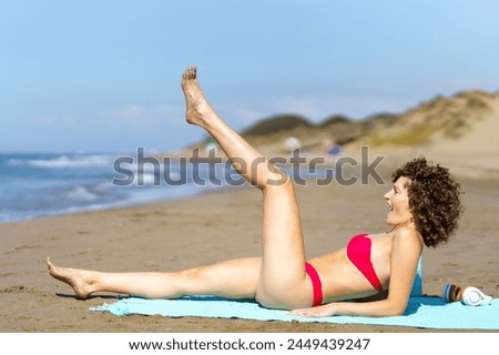 Similar – Image, Stock Photo Cheerful barefoot ginger woman waking up on bed