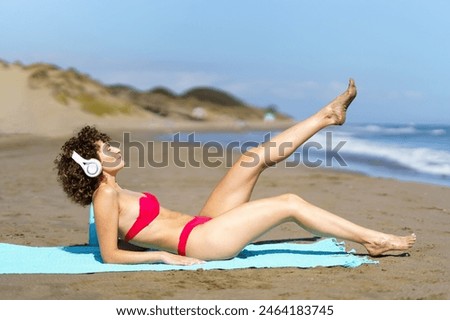 Similar – Image, Stock Photo Cheerful barefoot ginger woman waking up on bed