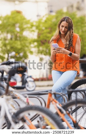 Similar – Image, Stock Photo Woman renting bike using rental app on mobile phone. Using bike sharing city service. Paid rent of electric scooter. Using smartphone to rent and pay for public eco transport