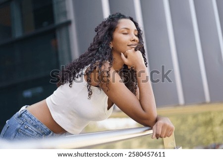 Similar – Image, Stock Photo Stylish tranquil woman against blue sky