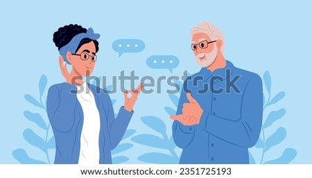 International day of sign languages. A pair of elderly deaf and mute people using sign language to communicate. A man and a woman with hearing impairment.