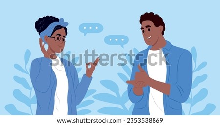 International day of sign languages. A pair of elderly deaf and mute people using sign language to communicate. A man and a woman with hearing impairment.