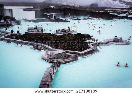 BLUE LAGOON, ICELAND - Aug 26 2014: People bathing in The Blue Lagoon, a geothermal bath resort in the south of Iceland, near Reykjavik. August 26, 2014 in Iceland.