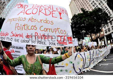 Rio de Janeiro downtown area - June 20, 2013: Woman protests against heavy taxes and corruption in Brazil.