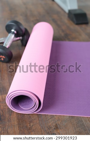 yoga mat spreading on wooden floor