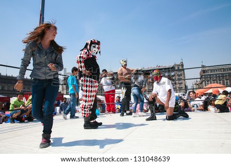 MEXICO CITY -MARCH, 3, 2012: Mexican luchadors entertain unidentified people with lucha libre on a Zocalo on march 3, 2012 in Mexico City, Mexico. Lucha Libre is very popular in Mexico.