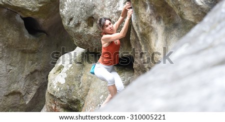 woman climbing forest of Fontainebleau