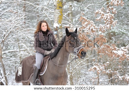 young woman riding in the snow