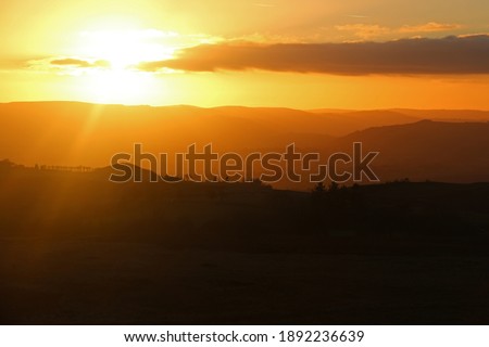 Similar – Foto Bild Sonnenuntergangshimmel über Hügeln in der Wüste