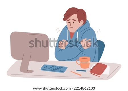 Man freezing in the unheated office. Feeling cold at work. Energy crisis. Economy of gas. Character wearing informal warm clothes trembling with cold at work place. 