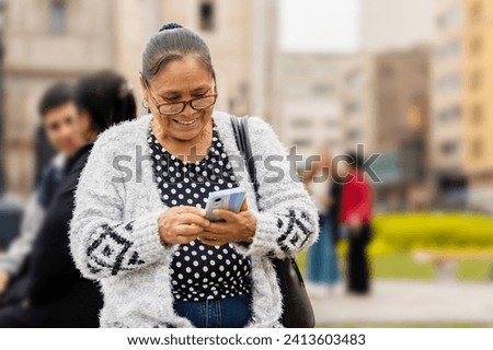 Similar – Image, Stock Photo Senior woman using mobile phone at home