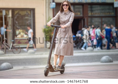 Similar – Image, Stock Photo Woman on electric kick scooter