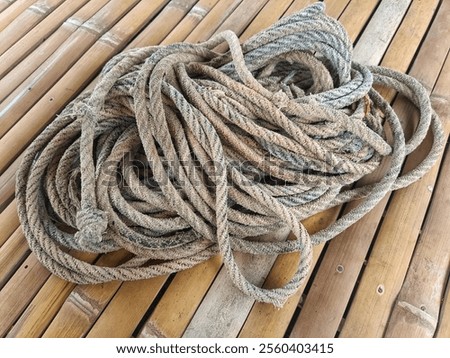 Similar – Image, Stock Photo Coil of used mooring ropes.