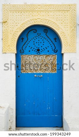 Blue door with ornament and arch from Sidi Bou Said in Tunisia. Large resolution