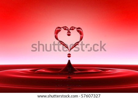 Heart shaped red water drops and splashing with waves. FAQ concept. Extralarge resolution