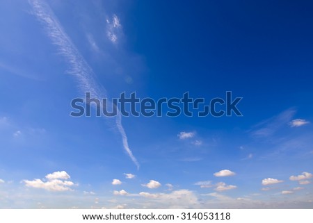 Clear blue sky with white cloud on a summer shiny day