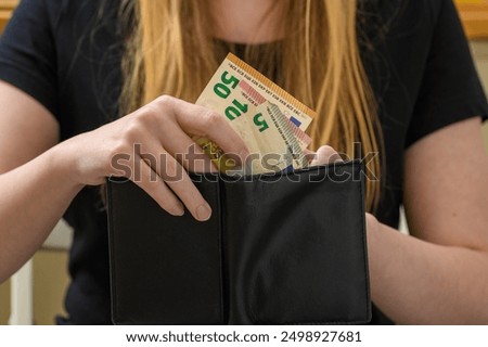 Similar – Image, Stock Photo Hands take out Euro from wallet
