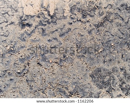 Stock macro photo of the texture of mud on a tire wall.  Useful for abstract backgrounds and layer masks.