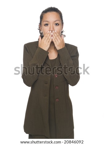 Isolated studio shot of a businesswoman in the Speak No Evil pose.
