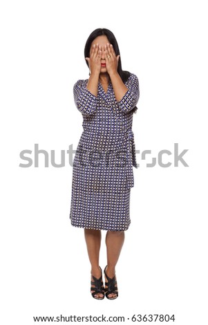 Isolated full length studio shot of a Latina woman in the See No Evil pose.