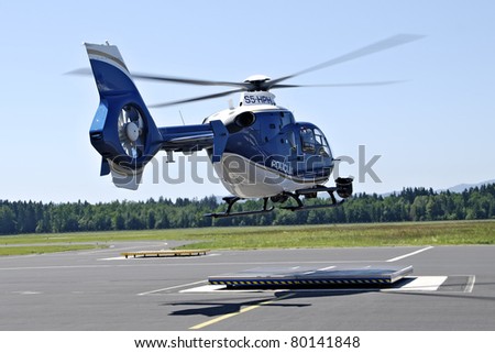 LJUBLJANA, SLOVENIA - JUNE 21: Slovenian police helicopter Eurocopter (registration S5-HPH), lands on Ljubljana Airport, after he arrives from the regular patrol, on June 26,2011.