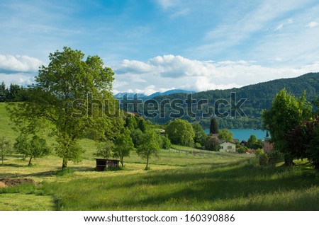 rural austrian landscape with a view over the worther see in carinthia